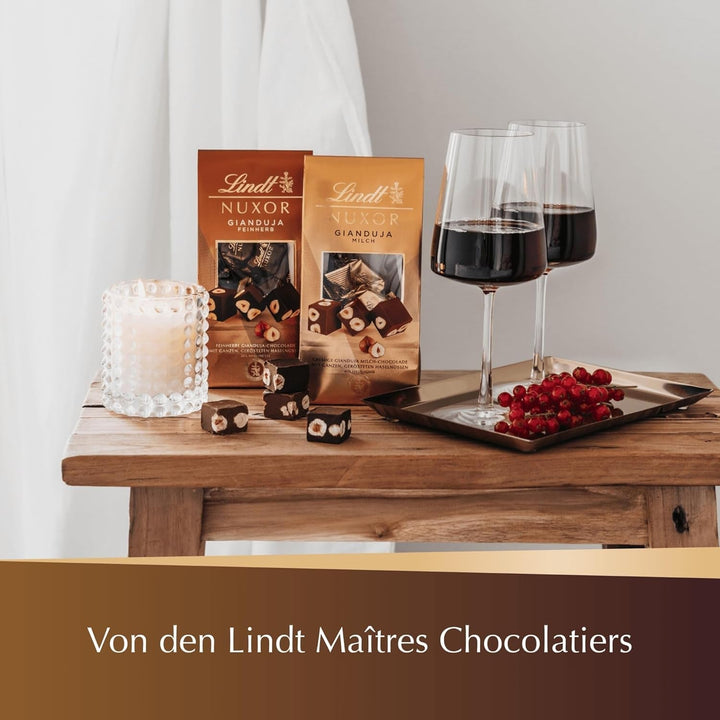 Ciocolată Lindt NUXOR alba cremoasă cu alune prăjite întregi, 103 grame Naty Shop